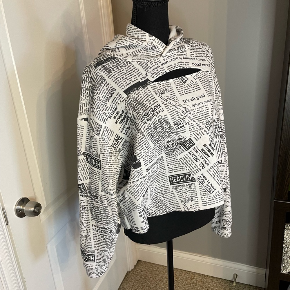 Women’s crop newspaper hooded with cutout, size large